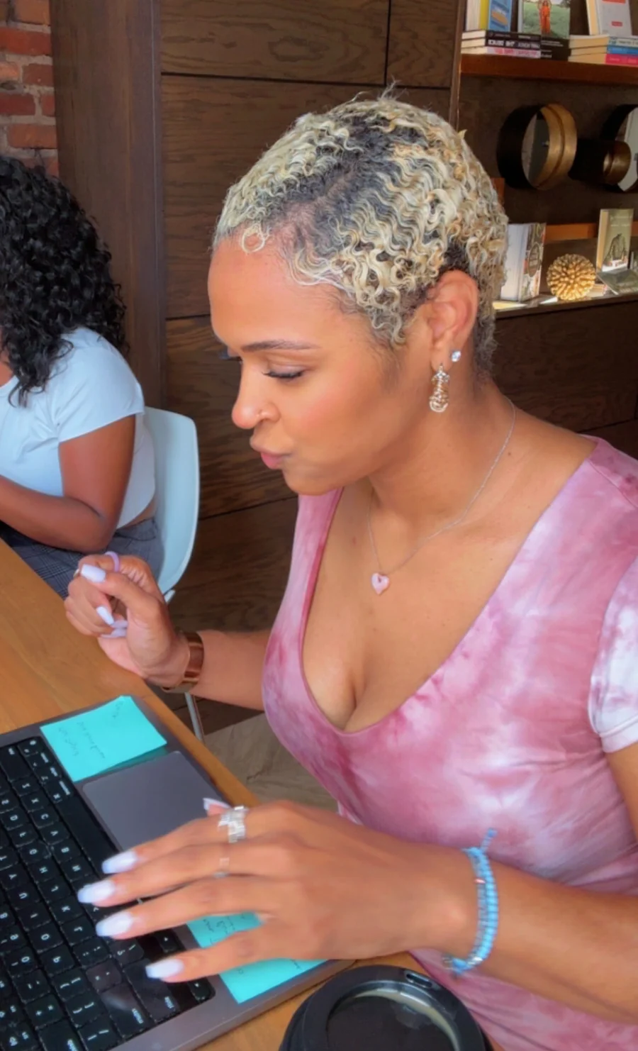 Karima Williams working at her laptop